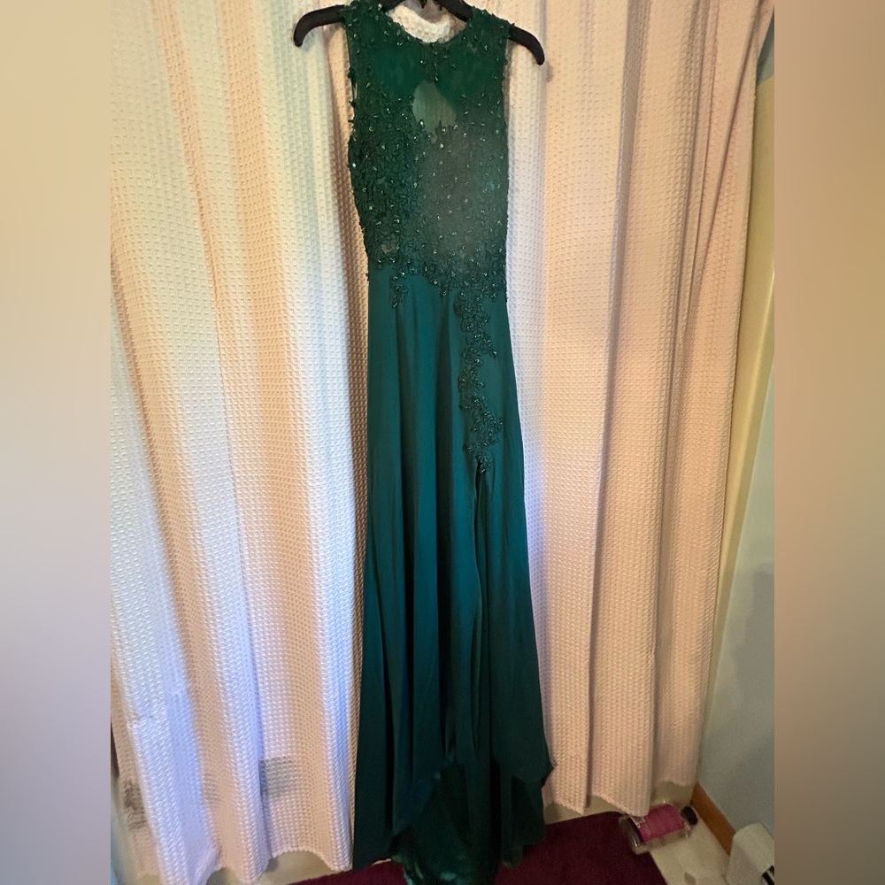 Dark green prom dress worn one, mid thigh slit, flowing bottom, open backed